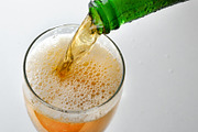 Filling glass with sparkling drink from green bottle, a Food & Drink Photo by Davizro's Market (Thumbnail 2 of 2)