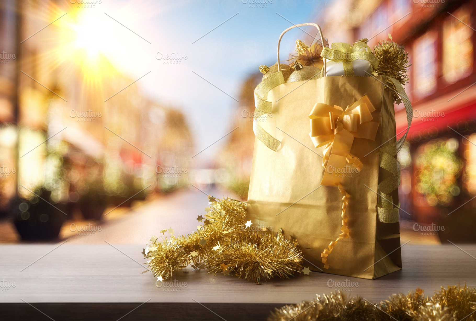 Christmas shopping concept with gift bag on street with shops, a Holiday Photo by Davizro's Market