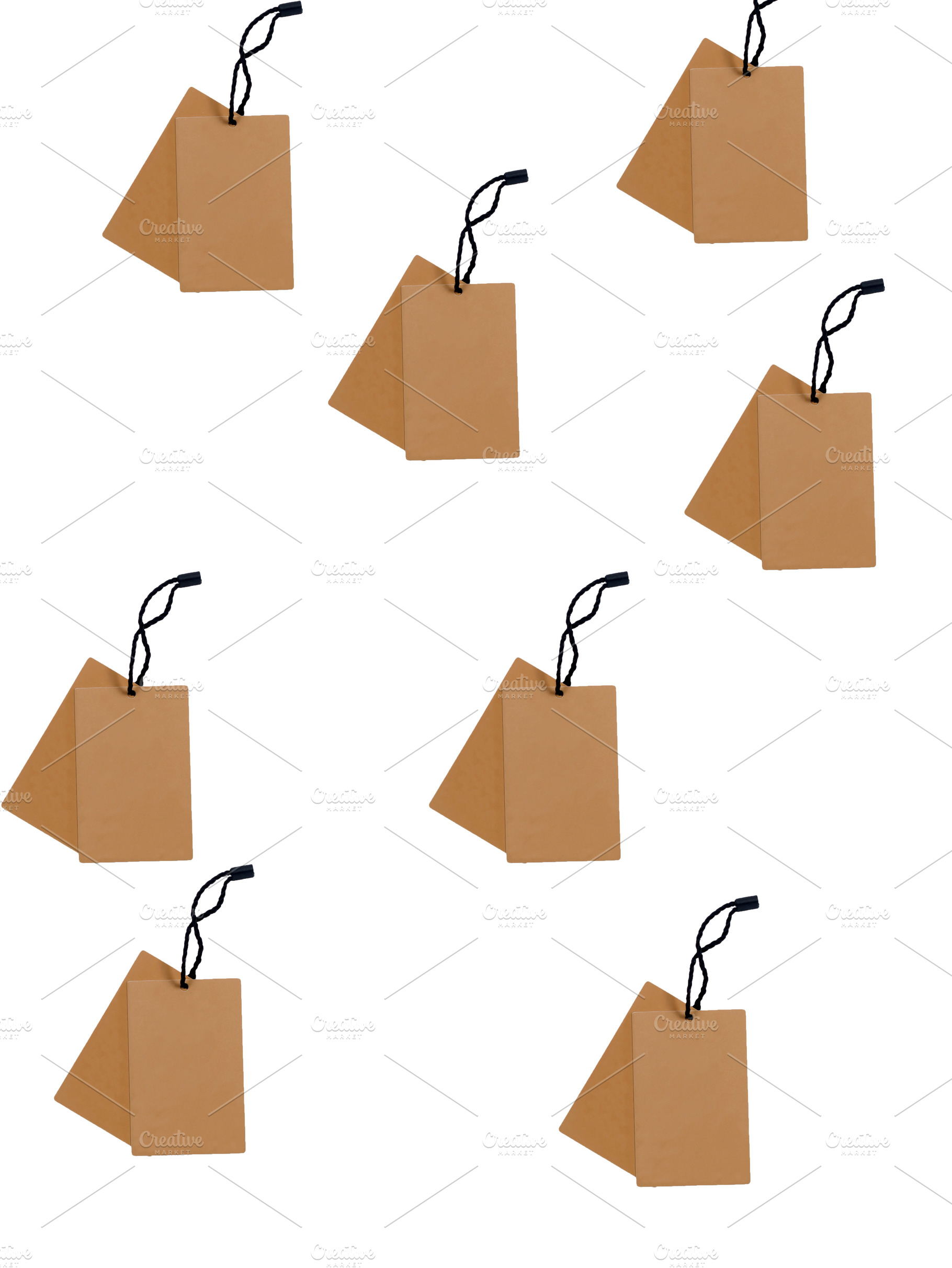 Many empty brown cardboard tag with string on white, a Background Photo by vimart