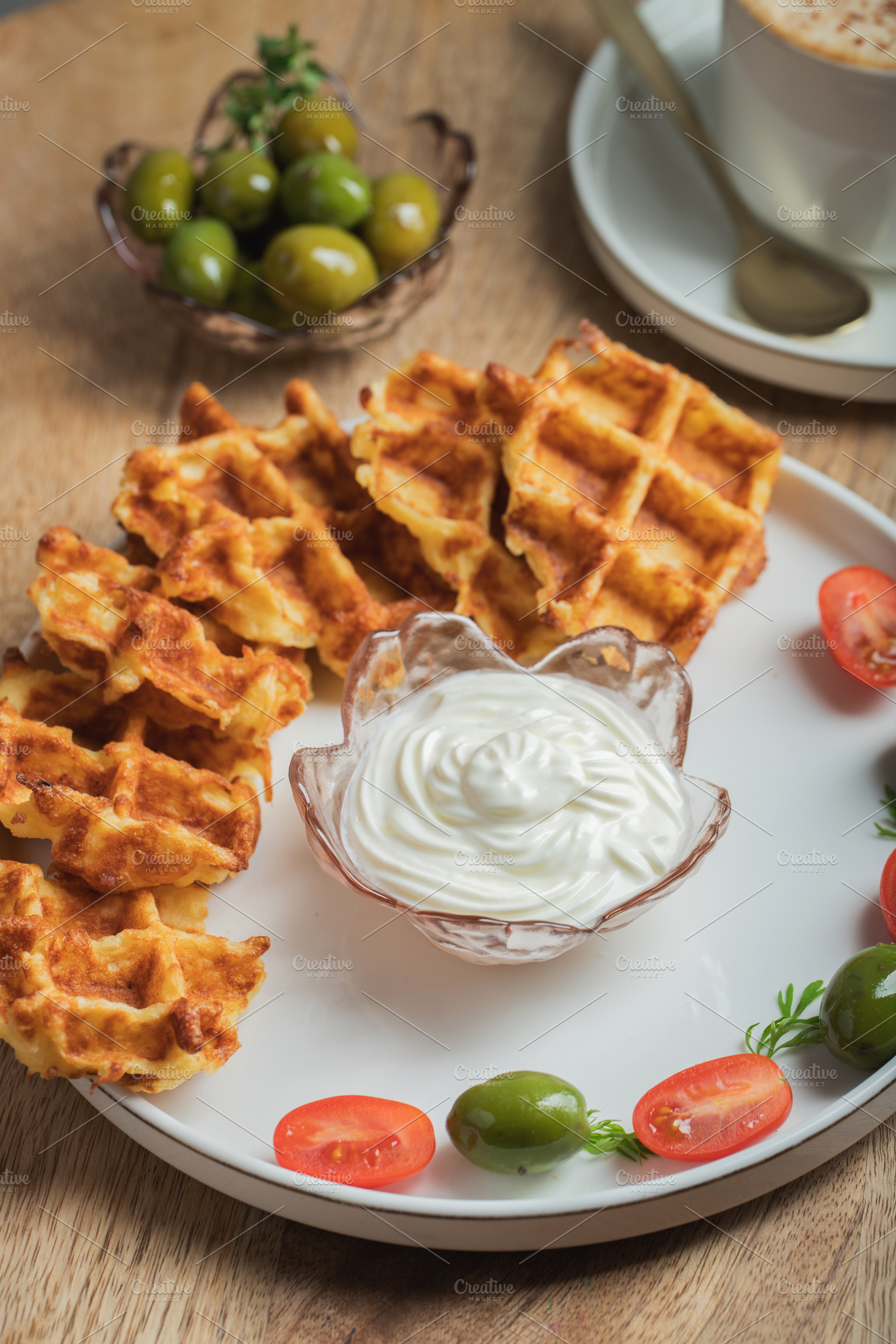 Top view of Homemade Potato Waffles, ricotta cheese and mayonese sauce. Served, a Food & Drink Photo by Budarinphoto