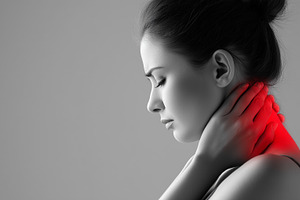 Woman holding her neck in pain with, a Health & Medical Photo by MistyDay