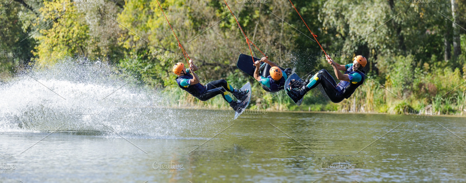 Sportsman on wakeboard performing back roll inversion on the river, a Sports & Recreation Photo by serkum
