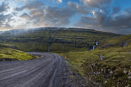 Gravel road and mountain view during auto trip in Iceland. Spect, a Nature Photo by YuriyB