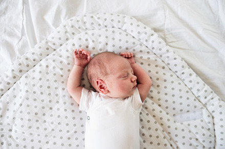 Newborn baby boy lying on bed sleeping close up containing child, baby, and, a Person Photo by HalfPoint