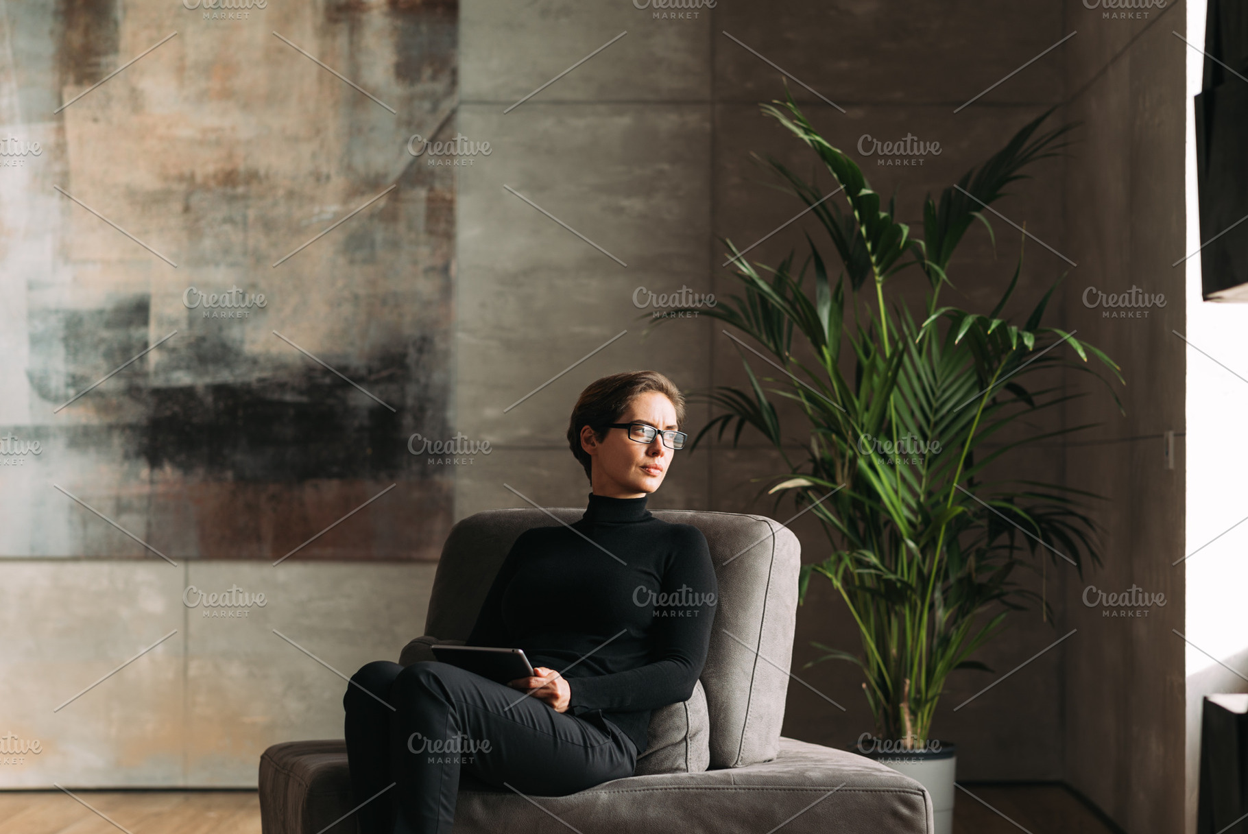Middle-aged woman in black wear, a Person Photo by Artem Varnitsin