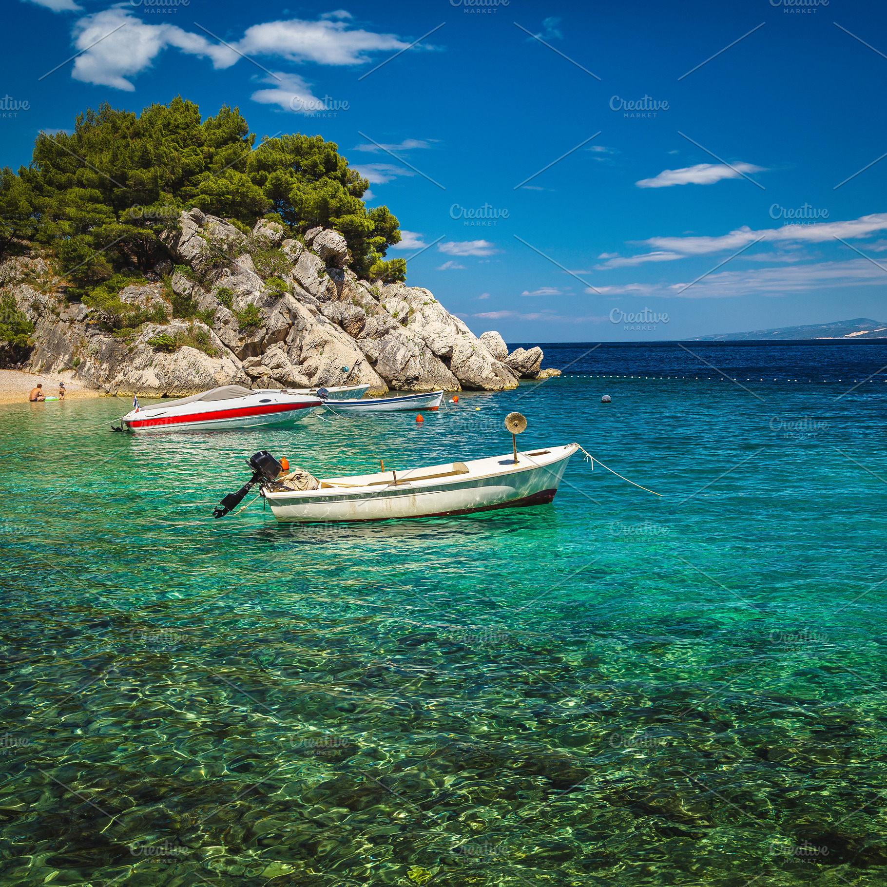 Amazing beach with motor boats, a Transportation Photo by Alpine Dreams