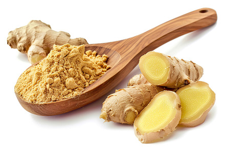 Ground dry ginger in wooden spoon isolated on white background, a Food & Drink Photo by AlyaAnd