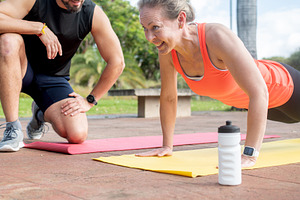 Woman doing push ups with personal trainer, a Sports & Recreation Photo by etorres69