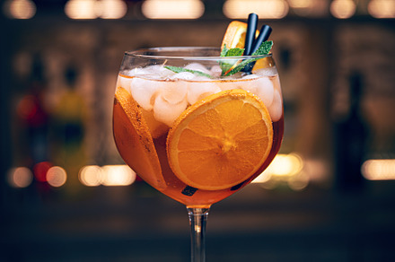 Orange cocktail with ice and mint