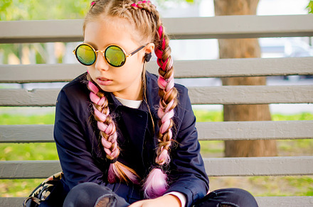 blonde girl wearing a sunglasses  with pink kanekalon in hair in, a Person Photo by vimart