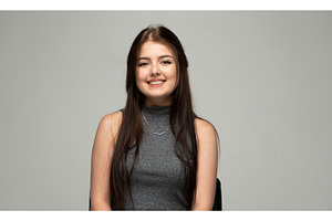 Happy young woman smiling, sitting, a Person Photo by volodymyrshtun13795