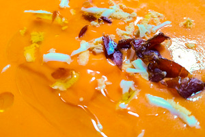 Salmorejo soup with ham and egg on rustic table, a Food & Drink Photo by DanFLCreativo