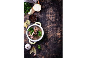 Boiled bone broth or bouillon with, a Food & Drink Photo by Yulia Furman
