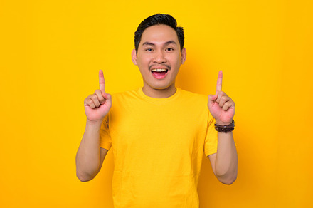 Asian man showing copy space, a Person Photo by Sewupari Studio