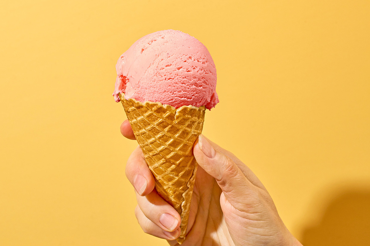 pink ice cream in human hand, a Food & Drink Photo by zeStudioPhoto (Photo 1 of 2)
