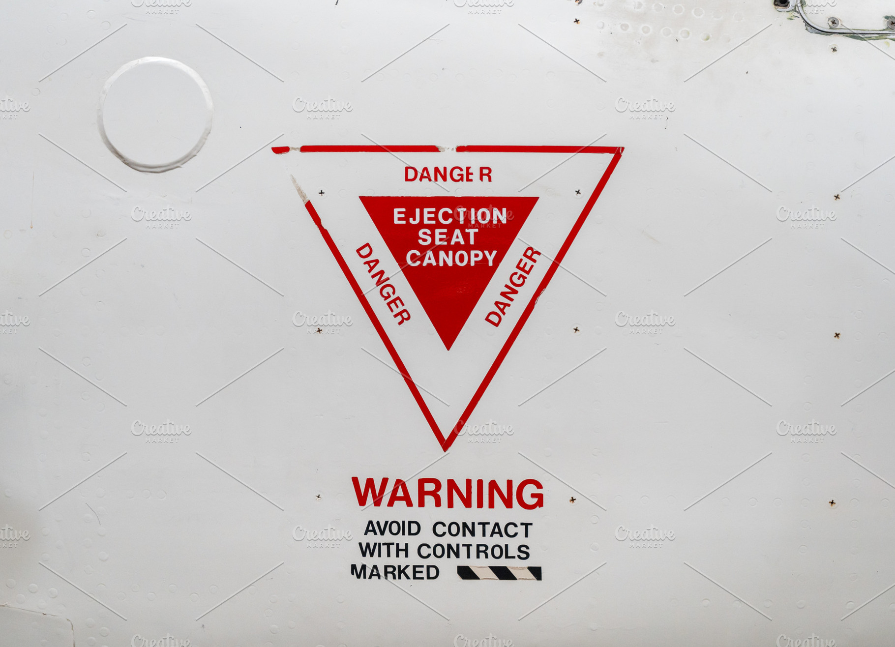 Ejection seat warning sign on the fuselage of an old aircraft, a Transportation Photo by GoodGoods