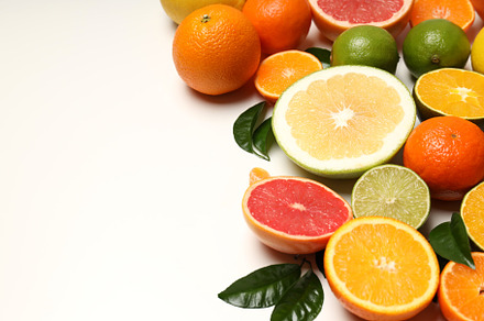 Citrus fruits with leaves on white background, a Food & Drink Photo by AtlasStudio PRO