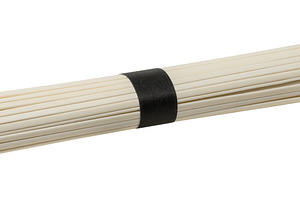 A bunch of dry white rice noodles tied tightly with a black pape, a Food & Drink Photo by ndanko