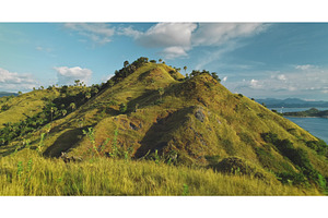 Lush green hills overlooking, a Nature Photo by Goinyk