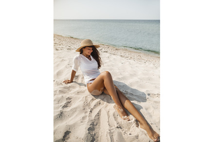 Woman Resting on the Beach During, a Holiday Photo by Emotion photo