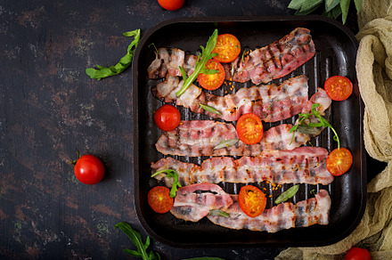 Fried bacon and tomatoes containing bacon, american, and background