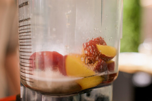 Electric blender making fruit drink peaches syrup, a Food & Drink Photo by Photo Drive Studio