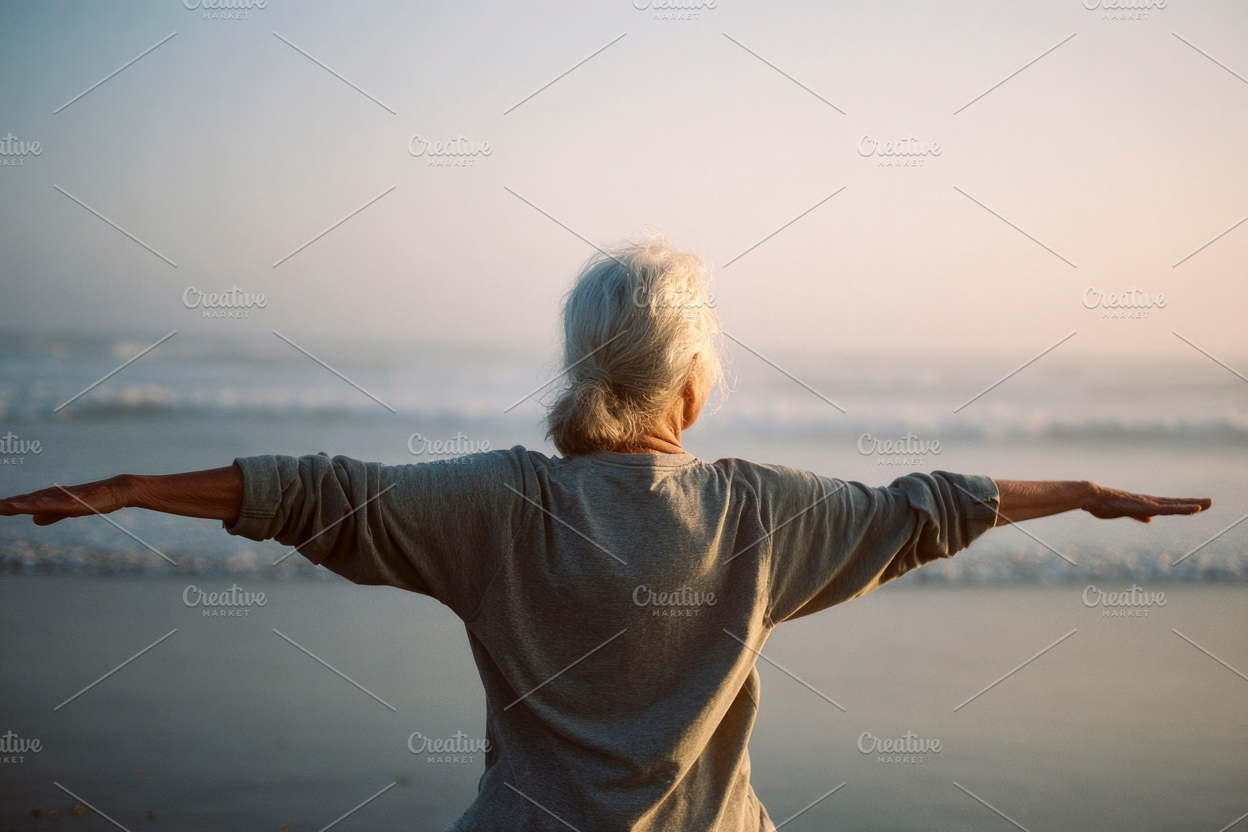 elderly woman stretching arms at sunrise, generative AI, a Photo by Nito