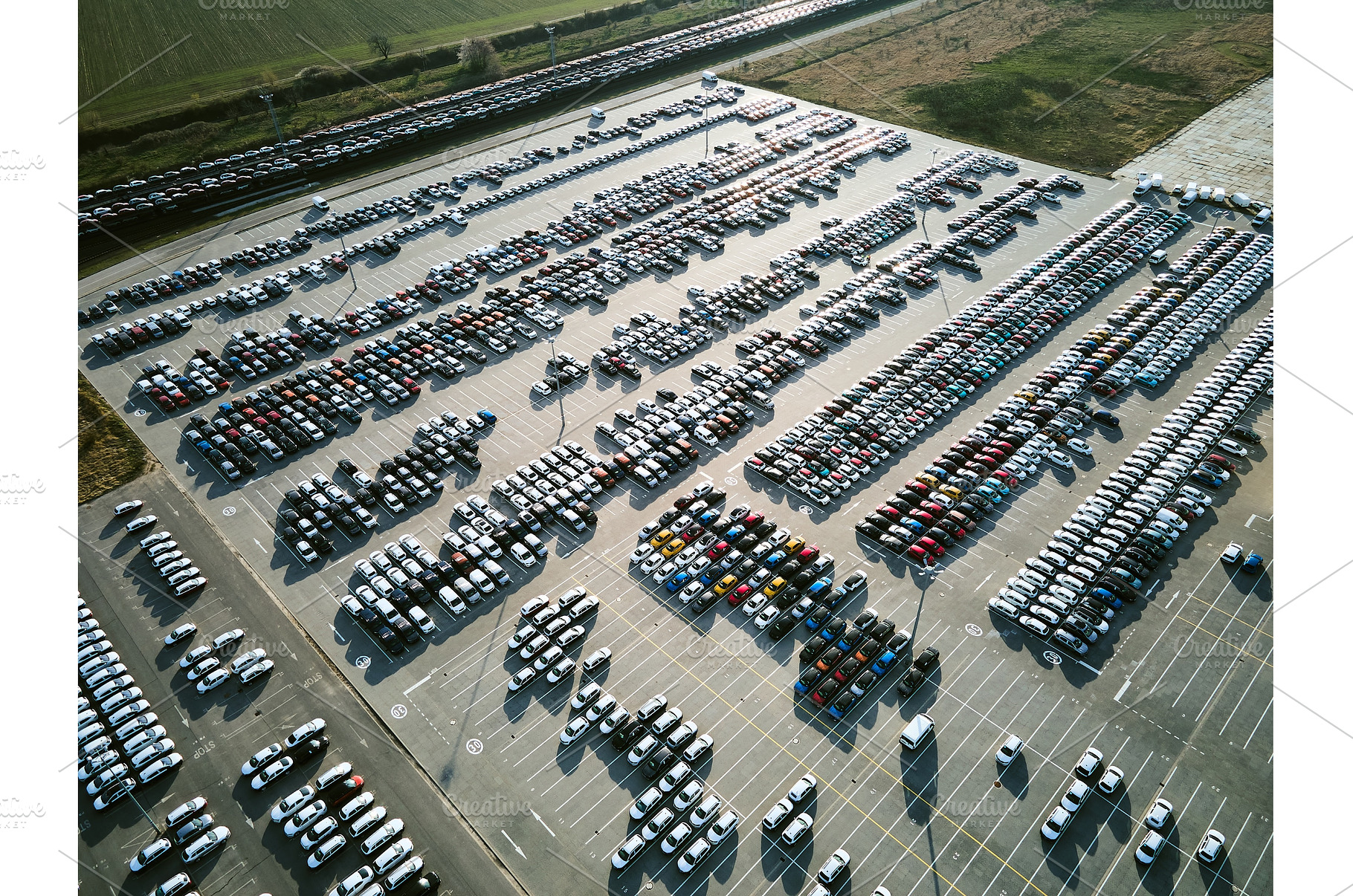 Aerial view of a massive parking lot, an Industrial Photo by HalfPoint