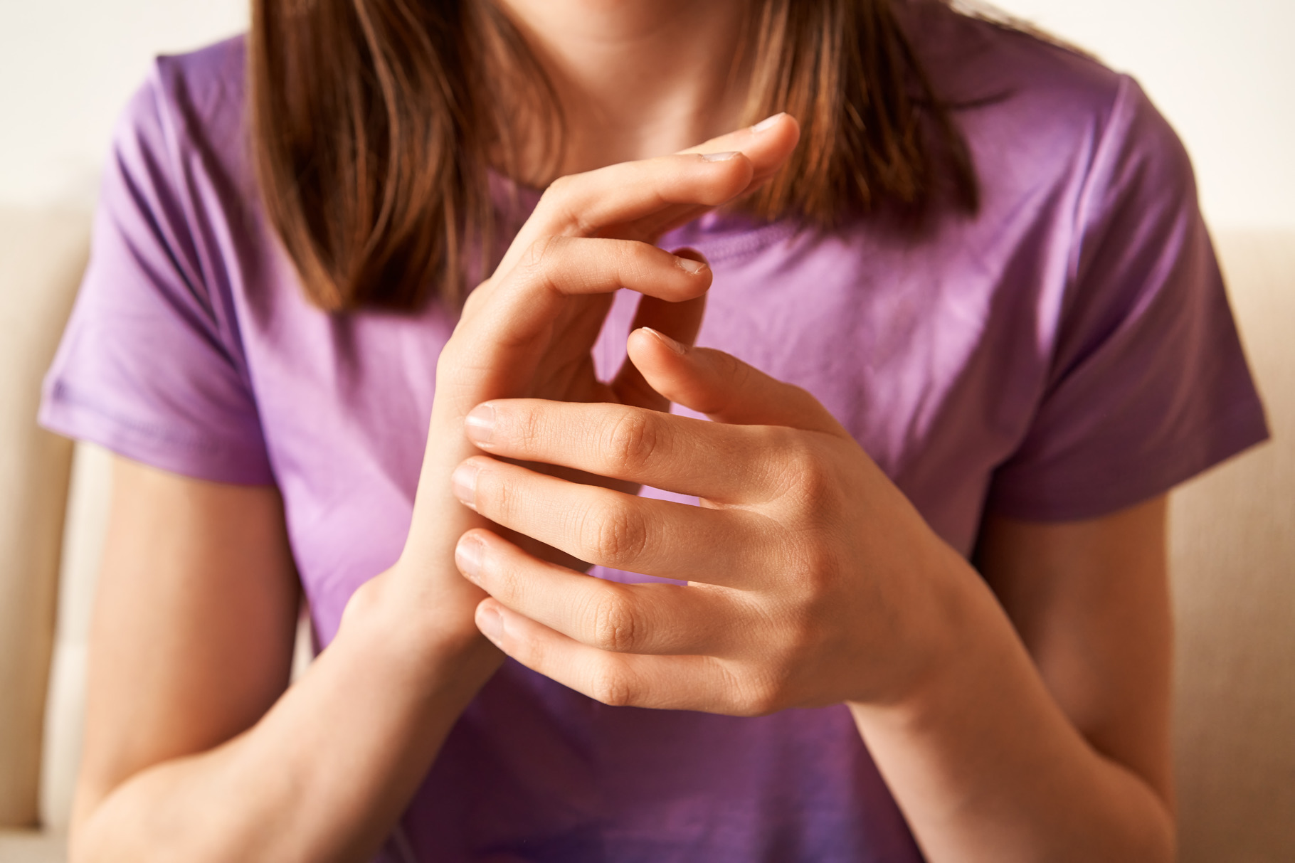 Teenage girl practicing EFT tapping - emotional freedom techniqu, a ...