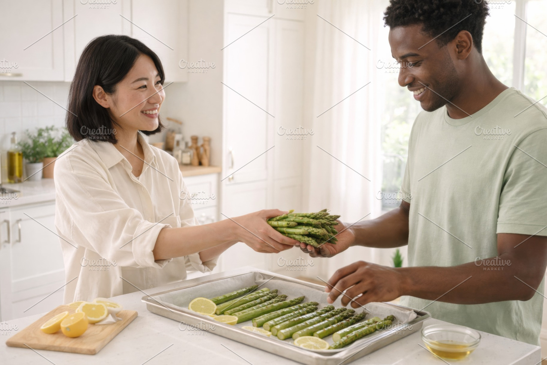 Couple preparing asparagus in kitche, a Photo by Dvoevnore photos