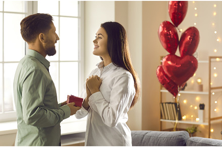 Young man in love gives a ring to, a Person Photo by StudioRomantic