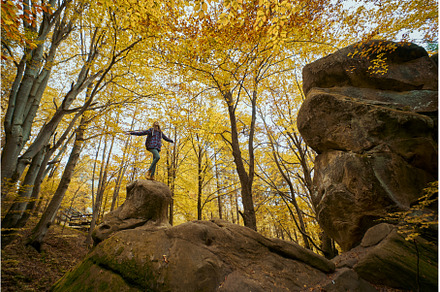 Woman standing on big old boulder in, a Nature Photo by vitaliymateha photography