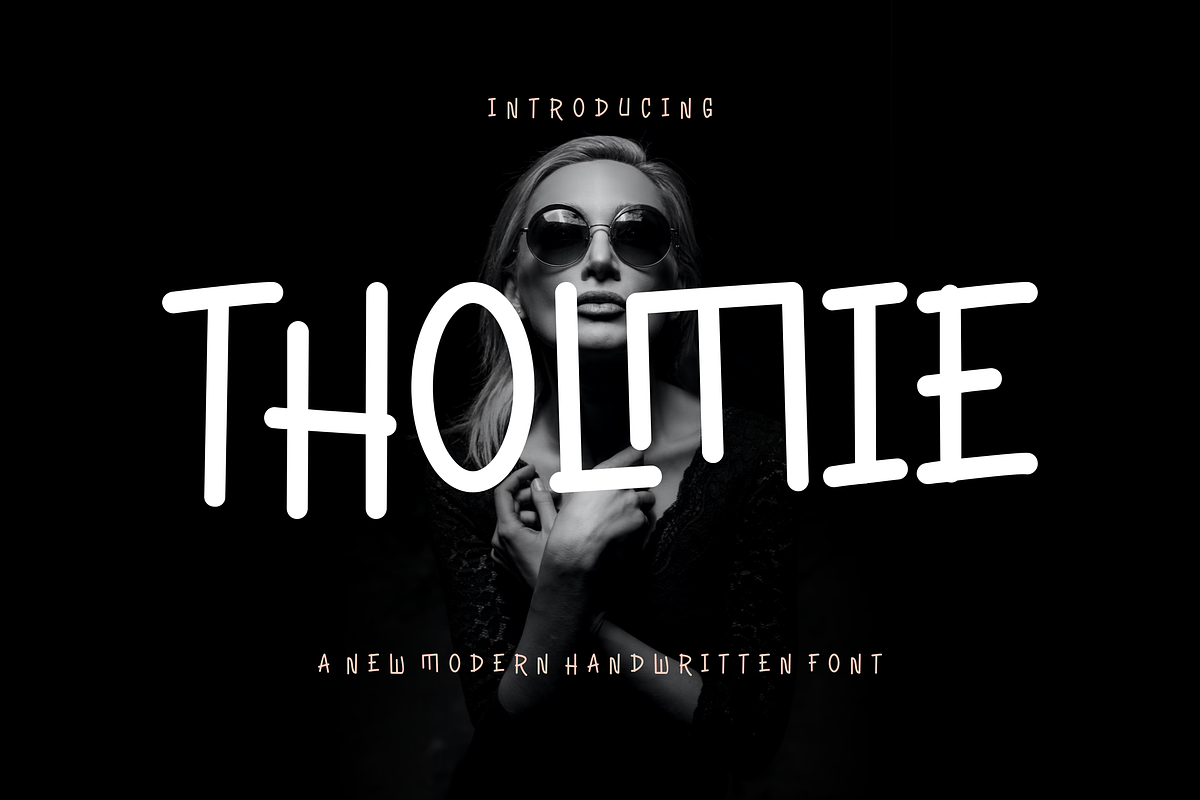 Tholmie - Font, a Handwritten Font by artchiles_design (Photo 1 of 5)