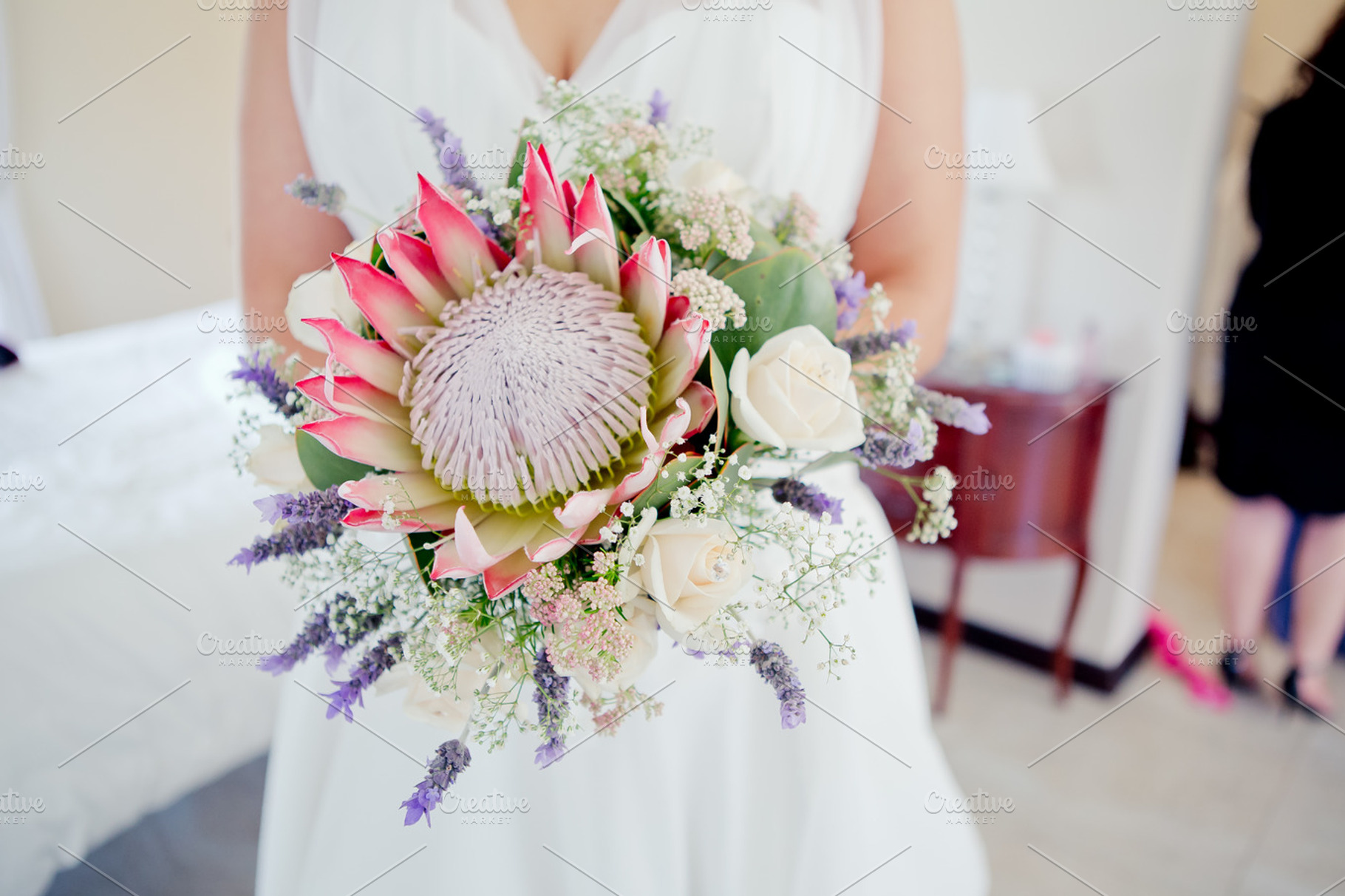 Protea bouquet containing protea, floral, and bouquet, a Person Photo by nzkiekies