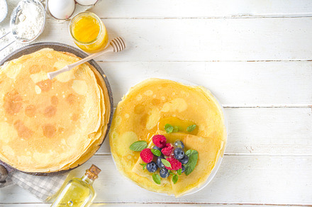 Crepes pancakes with berries, a Background Photo by Rimma