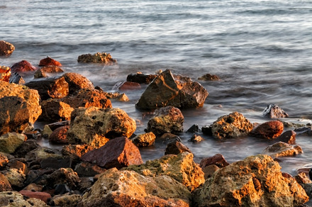 Long exposure of sea and rocks, sunset over the sea , long expos, a Nature Photo by TanaCh