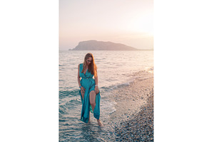 Woman in Flowing Dress on Seaside, a Person Photo by Jan Jack Russo Media