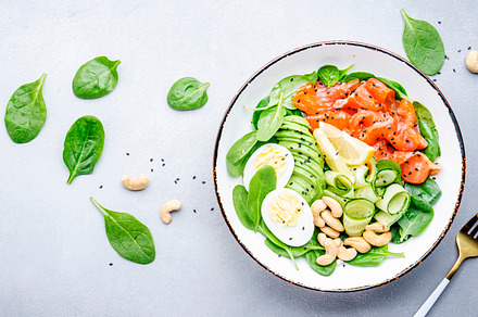 Ketogenic salad with salted salmon, avocado, spinach, cucumber,, a Food & Drink Photo by 5PH