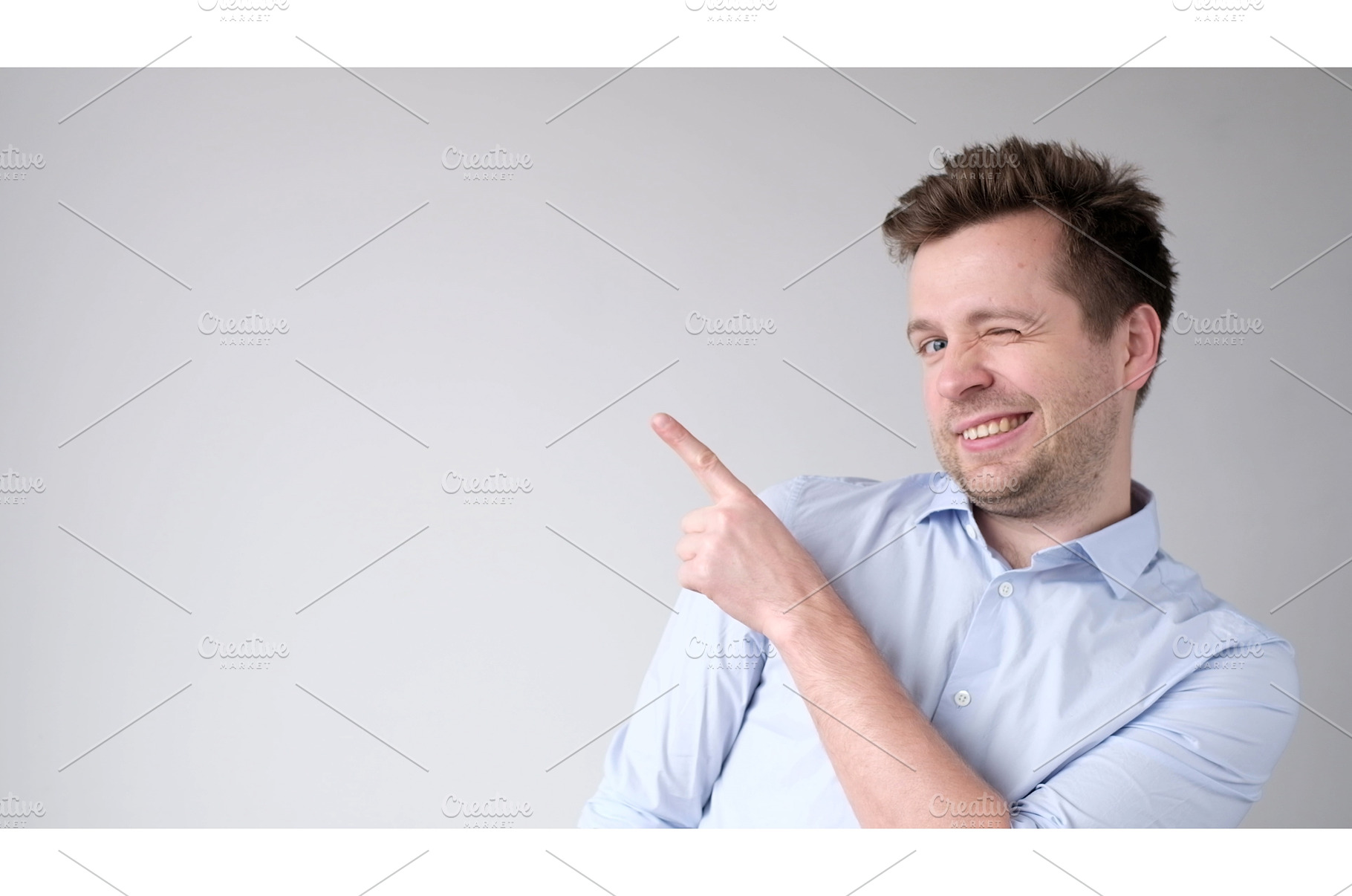 young man points with his index, a Person Photo by Koldunova