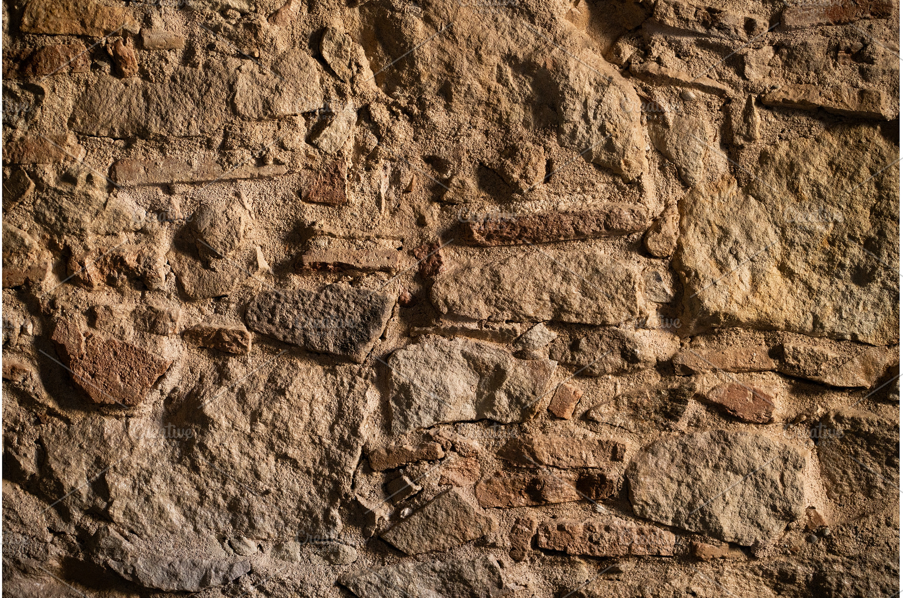 Rough ancient stone and rock wall, a Background Photo by volodymyrshtun13795