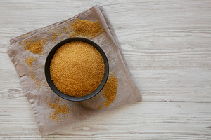 Organic Demerara Sugar in a Bowl, top view. Copy space., a Food & Drink Photo by LiudmylaChuhunova
