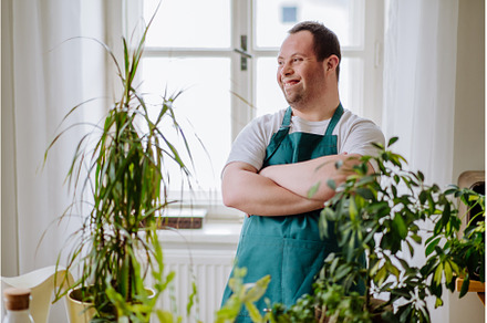 Young man with Down syndrome taking, a Person Photo by HalfPoint