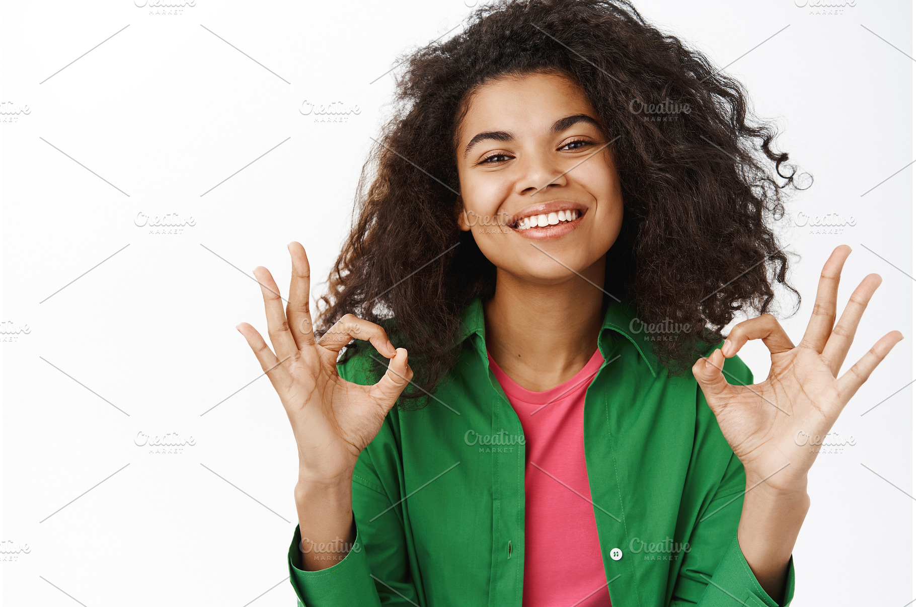 Positive smiling black girl, shows, a Person Photo by Cookie Studio