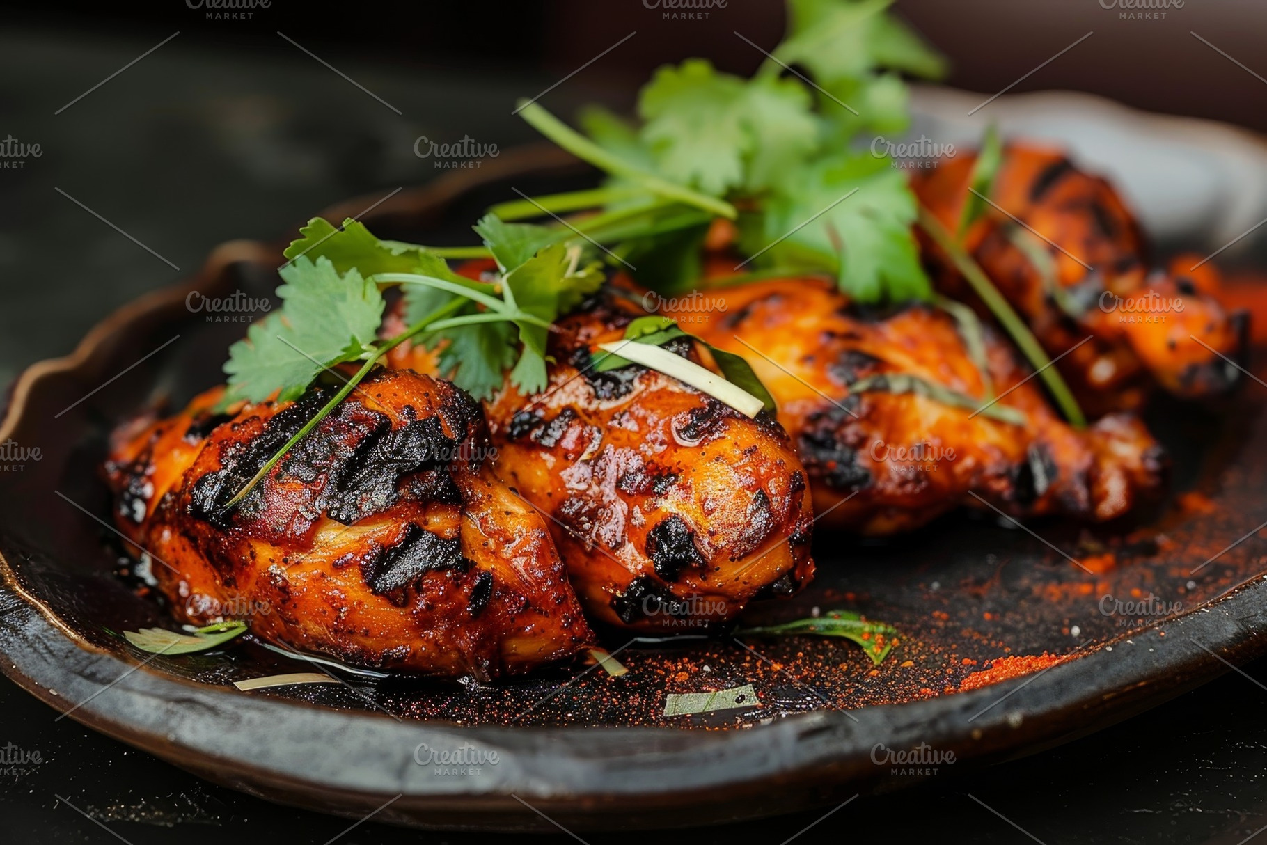 A plate holding grilled chicken, vib, a Photo by Iftikhar Alam