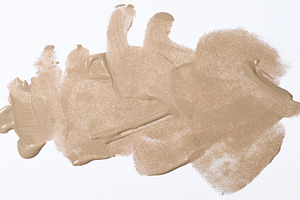 A broad brushstroke of nude or beige foundation with a distinct, a Beauty & Fashion Photo by ndanko