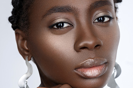 Beautiful black girl with big earrings stock photo containing natural and, a Beauty & Fashion Photo by Sweet Studio