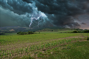 Electric storm with rays in the fiel