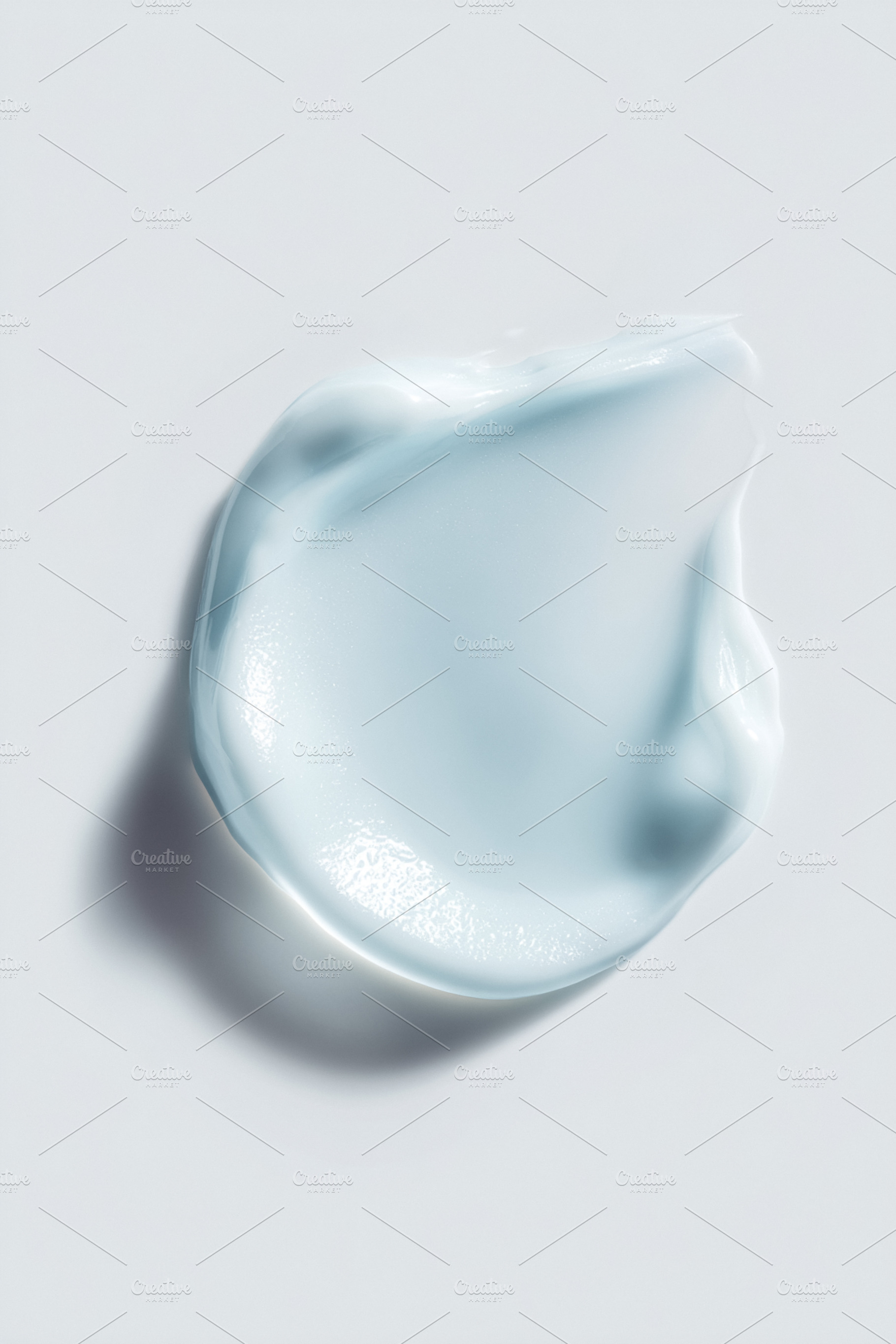 Light blue cosmetic cream swatch with smooth texture on a white, a Photo by Studio ANNA