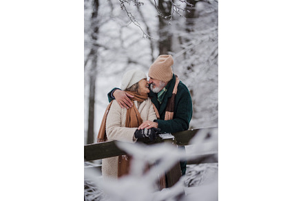 Elegant senior couple kissing in the, a Person Photo by HalfPoint