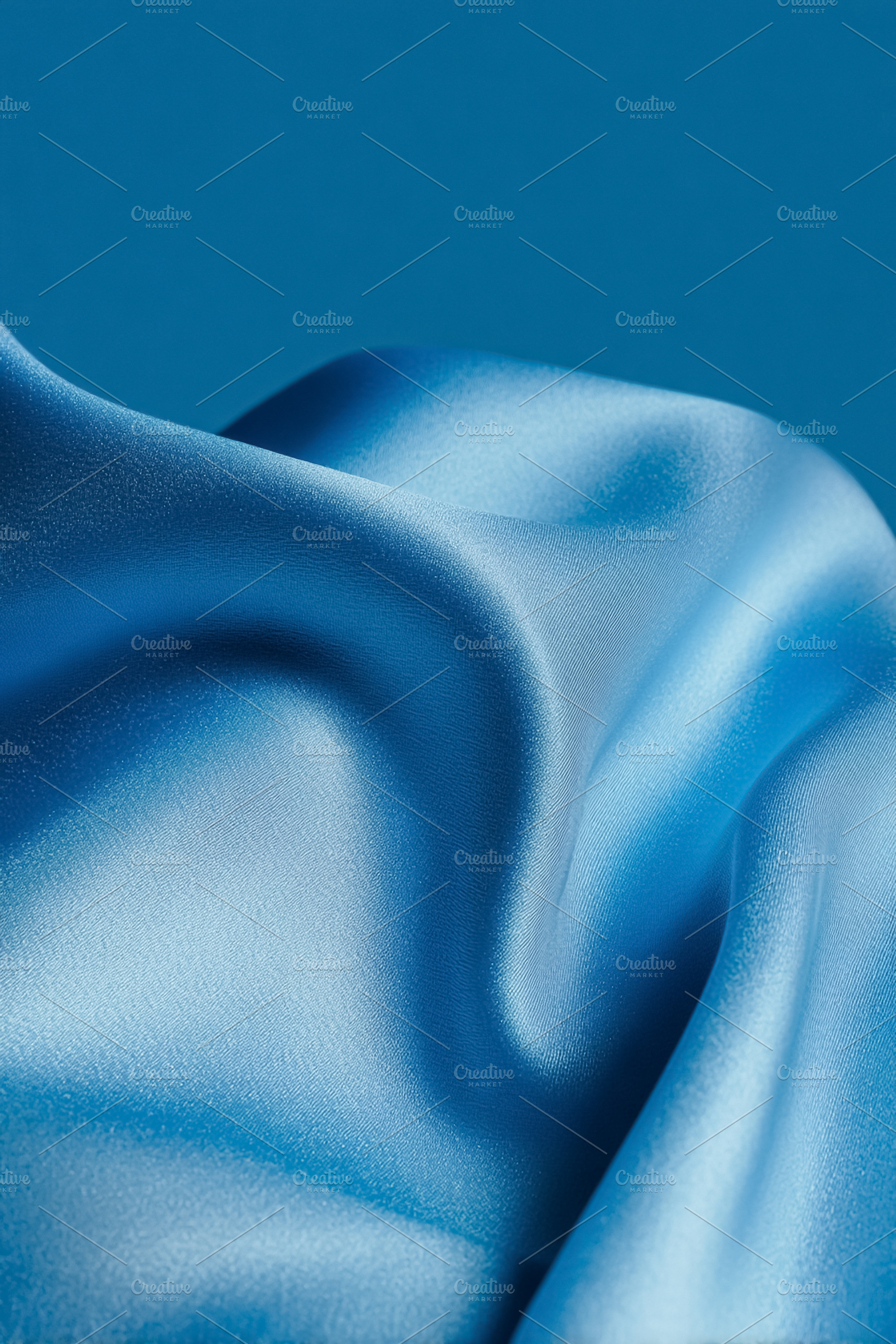 Blue satin fabric displaying soft waves and luxurious folds crea, a Photo by Studio ANNA